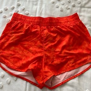 Bright Orange running shorts, size M